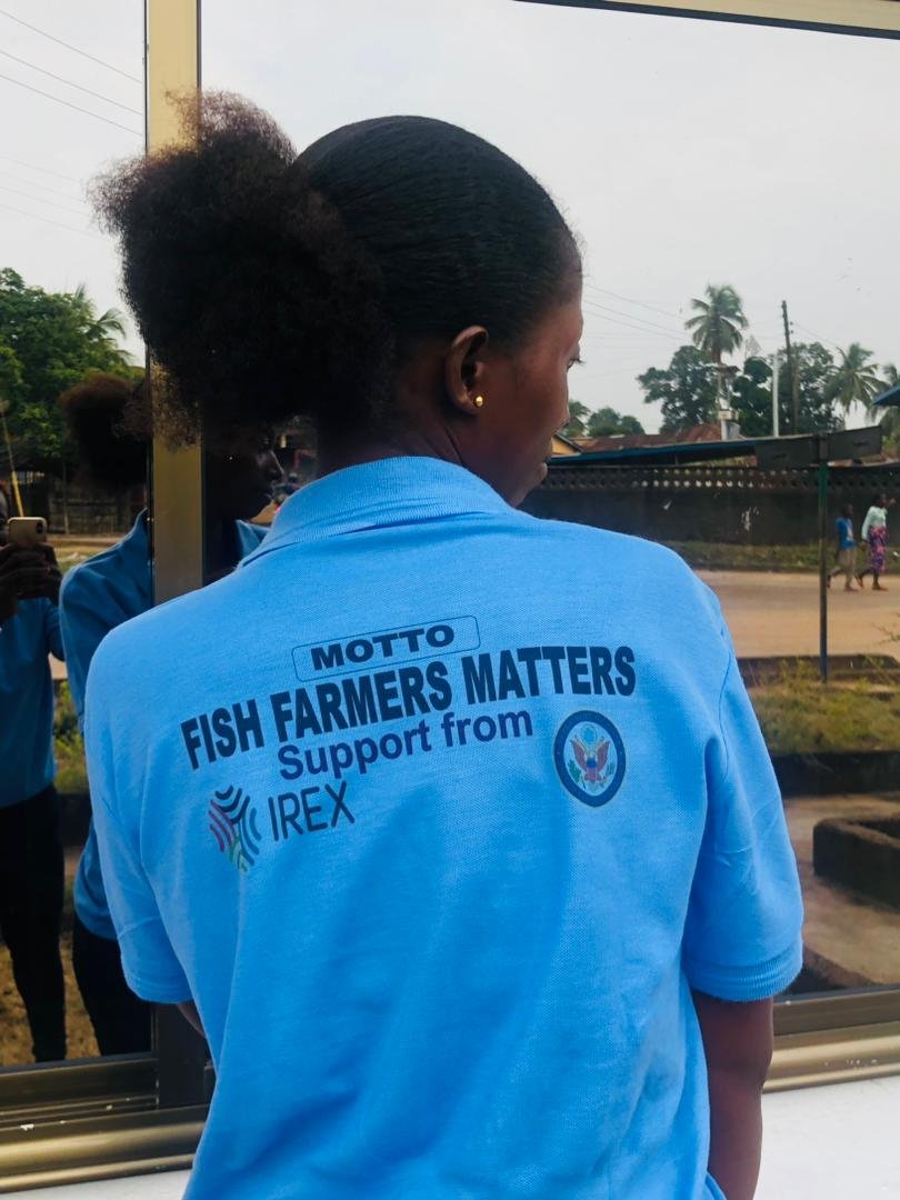 Back of a trainee shirt reading Fish Farmers Matters
