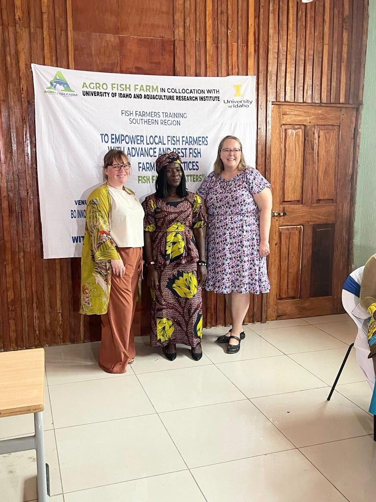 Agro Fish Farm team with training partners in front of the training banner